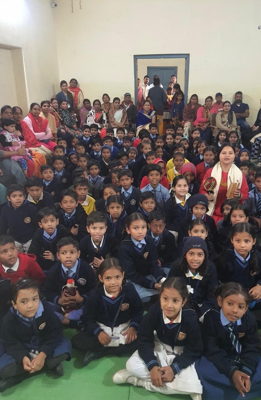 Large group storytelling session with manjira and shaker instruments