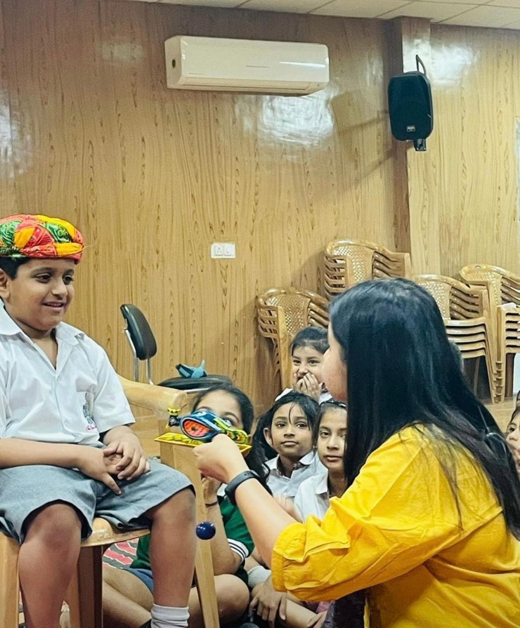 Theatre-in-education session with student in Rajasthani turban